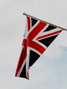 UK flag flying in the wind on a clear day